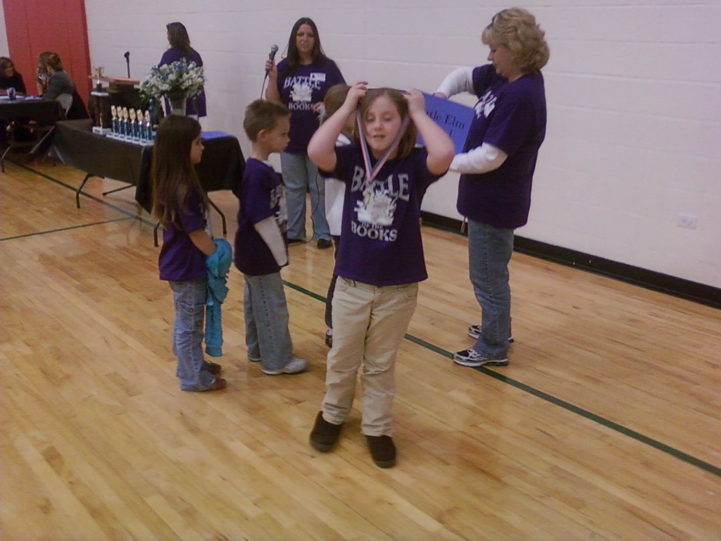 Jamie and her medal for Battle of the Books.