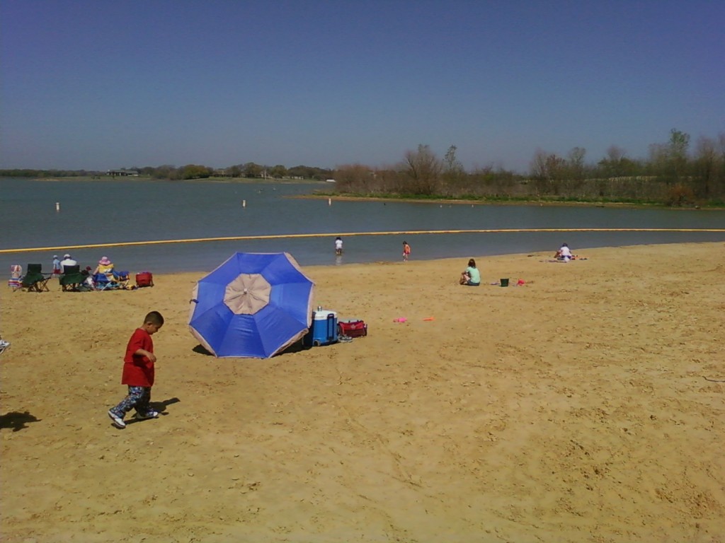 At the beach swimming.